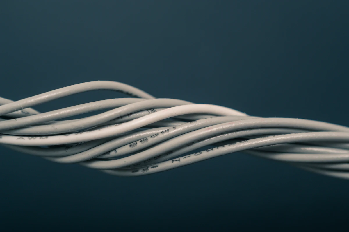 Precision electrical wiring — the hands-on craft at the core of the YKCA culture.